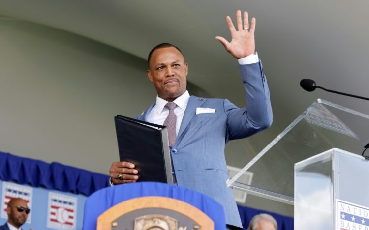 Dominican star Adrian Beltre waves to the crowd after being inducted into the Baseball Hall of Fame. ©AFP