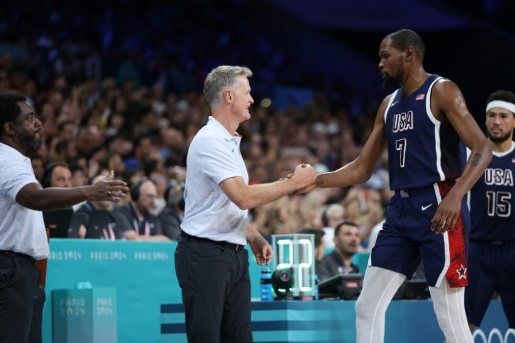 Kevin Durant (right) is congratulated by USA coach Steve Kerr during Sunday's win over Serbia in the Olympic basketball tournament. ©AFP