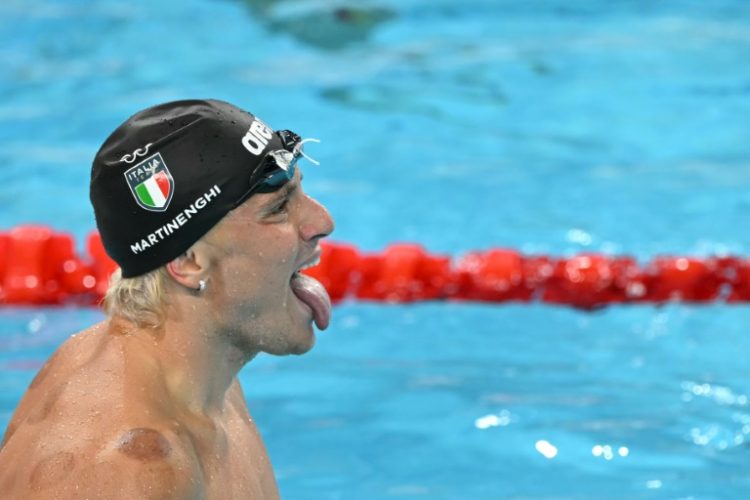 Italy's Nicolo Martinenghi celebrates after winning the final of the men's 100m breaststroke . ©AFP