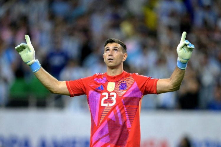 Argentina's goalkeeper Emiliano Martinez celebrates after his shoot-out heroics helped the world champions into the semi-finals of the Copa America on Thursday. ©AFP