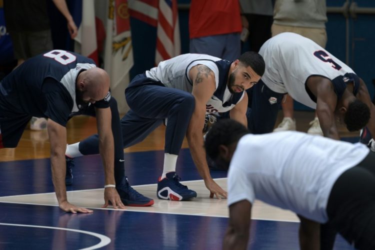 Boston star Jayson Tatum (centre) was left out of the USA's opening Olympic win over Serbia. ©AFP