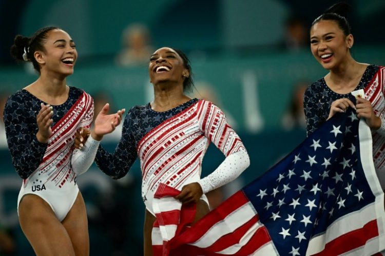 Simone Biles and US teammates celebrate after winning Olympic gold in the women's gymnastics team final. ©AFP