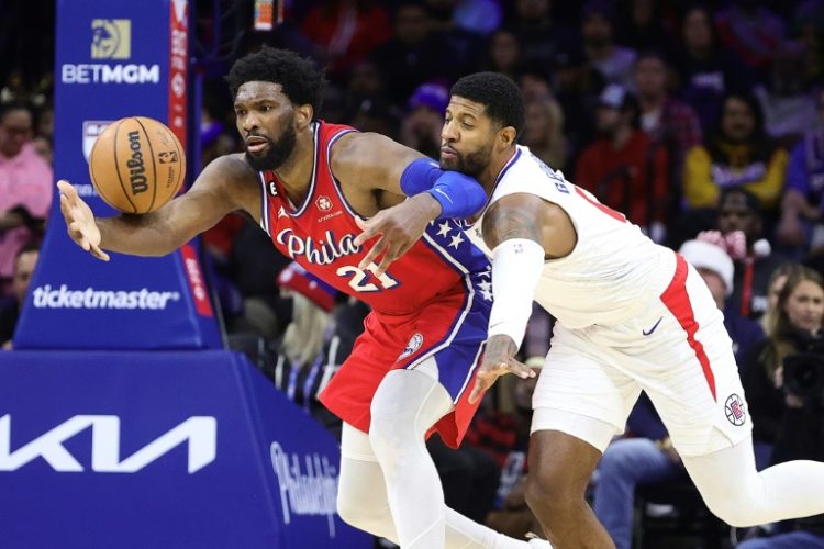 Paul George (right) is set to be team-mates with Joel Embiid (left) after agreeing a deal to join the Philadelphia 76ers in free agency. ©AFP