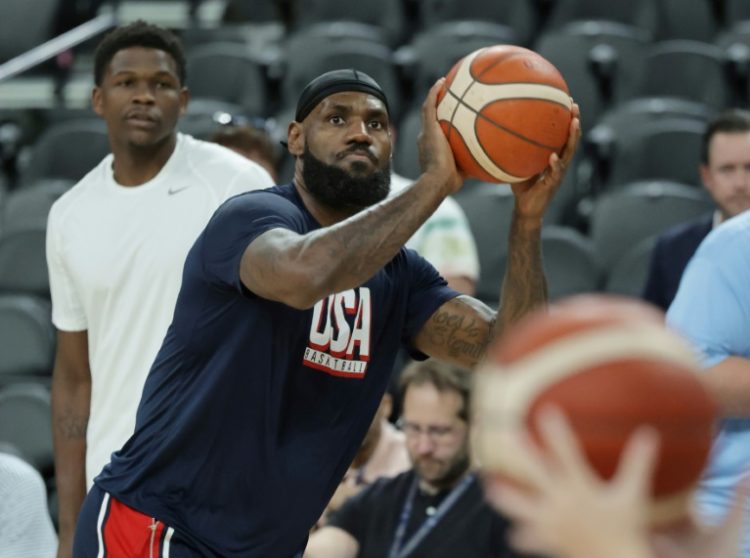 LeBron James warms up under the gaze of team-mate Anthony Edwards before the USA's victory over Canada in Las Vegas on Wednesday. ©AFP