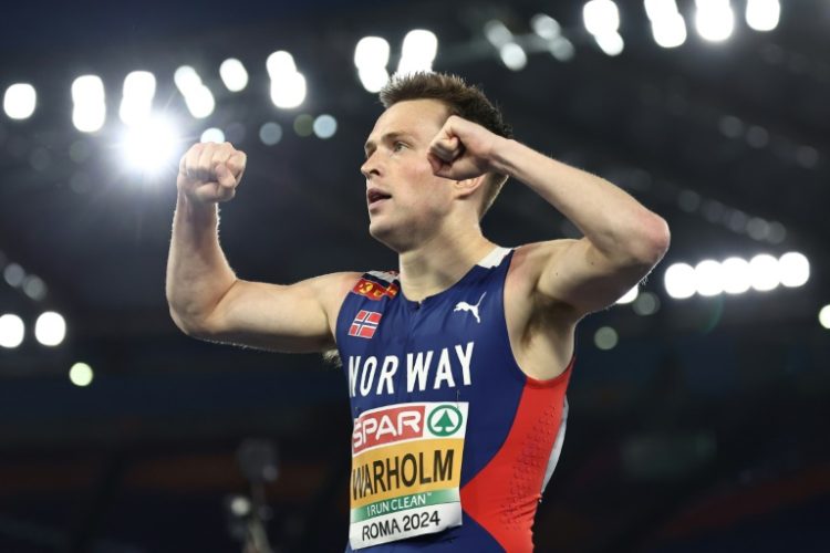 Karsten Warholm celebrates winning gold at the European Athletics Championships in June. ©AFP