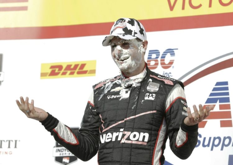 Penske driver Will Power of Australia, seen here celebrating an IndyCar win in Wisconsin, added a second victory of 2024 at Iowa Speedway. ©AFP