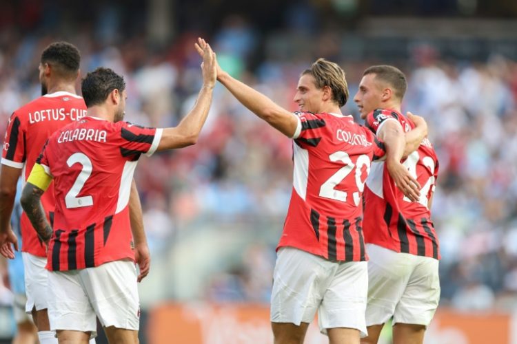 AC Milan's Lorenzo Colombo, at center right, high fives a teammate to celebrate scoring a goal in the Italian club's 3-2 victory over Manchester City. ©AFP