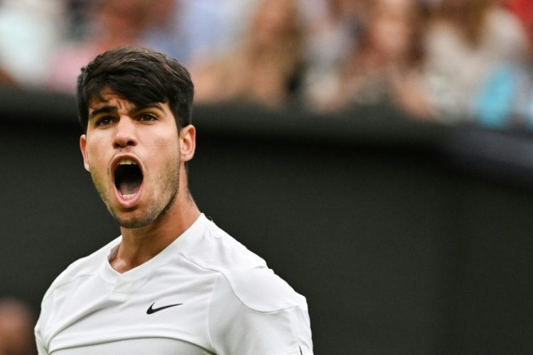 Carlos Alcaraz battled back to beat Frances Tiafoe in the Wimbledon third round. ©AFP