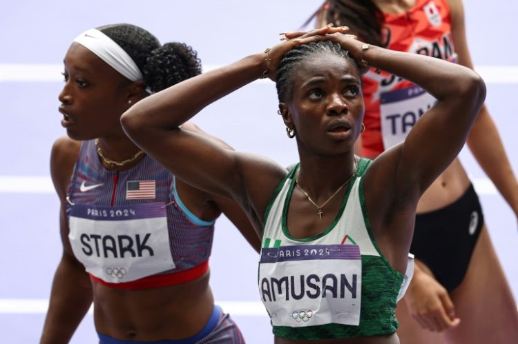 Nigeria's world record holder Tobi Amusan reacts after failing to qualify for the Olympic 100m hurdles final. ©AFP