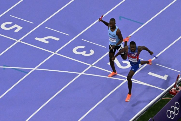 An overview shows Botswana's Letsile Tebogo and US' Rai Benjamin crossing the finish line. ©AFP