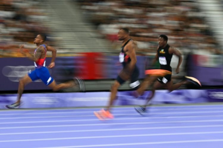 Olympic 400 metres champion Quincy Hall (L) models himself on the characteristics of the dogs he breeds. ©AFP