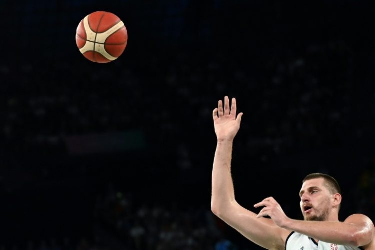 Serbia's Nikola Jokic puts up a shot in Serbia's victory over Australia in the Olympic men's basketball quarter-finals. ©AFP