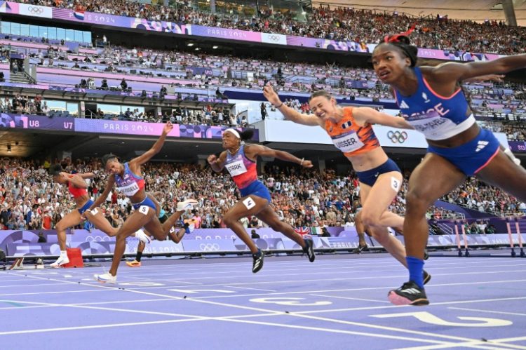 Masai Russell (2L) crosses the finish line just ahead of France's Cyrena Samba-Mayela (R) in the Olympic women's 100m hurdles. ©AFP