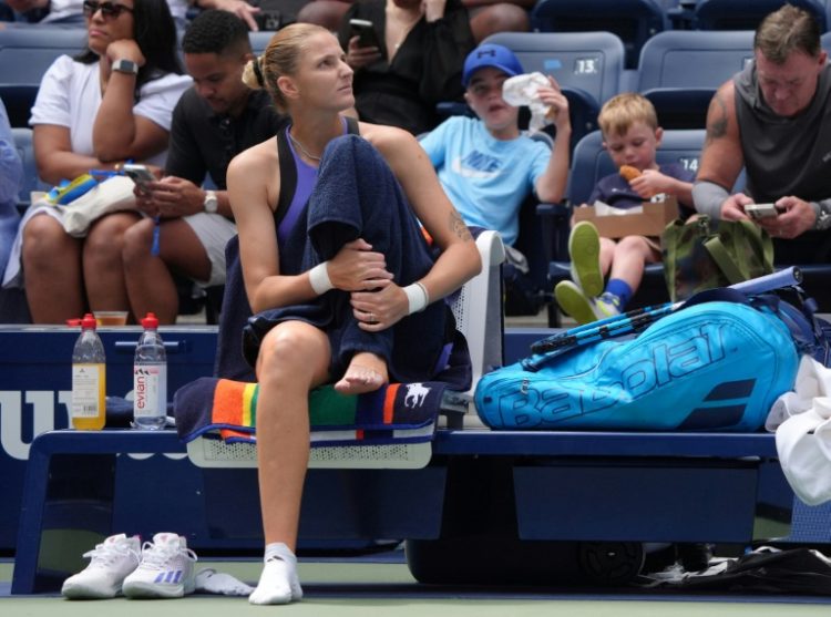 Painful end: Czech Republic's Karolina Pliskova suffered an ankle injury and retired after just three points against Jasmine Paolini. ©AFP