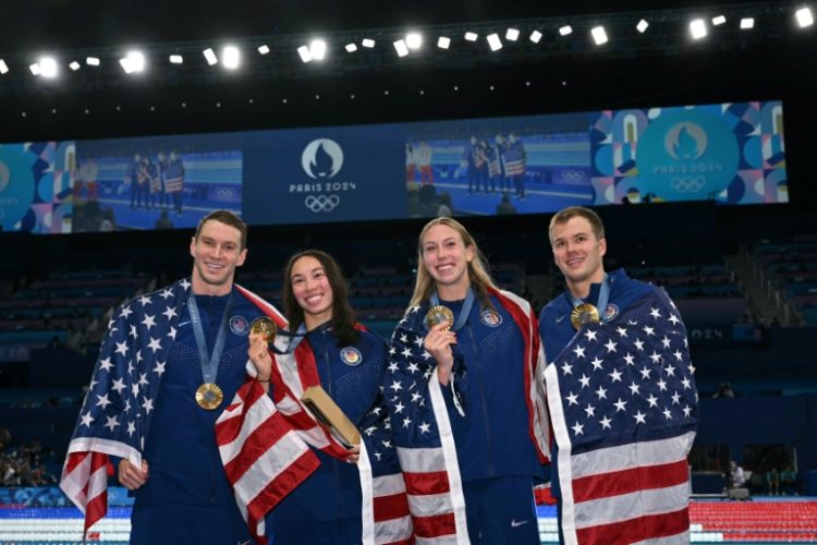 The USA's Ryan Murphy, Torri Huske, Gretchen Walsh and Nic Fink after winning the mixed 4x100m medley relay gold. ©AFP