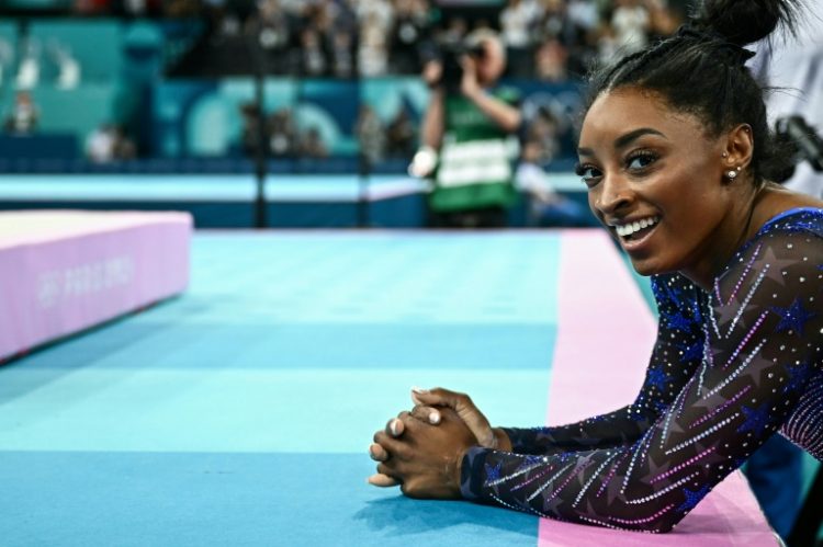 Simone Biles, with two Paris Olympics gold medals and counting, has cemented her legacy as the greatest gymnast of all time . ©AFP