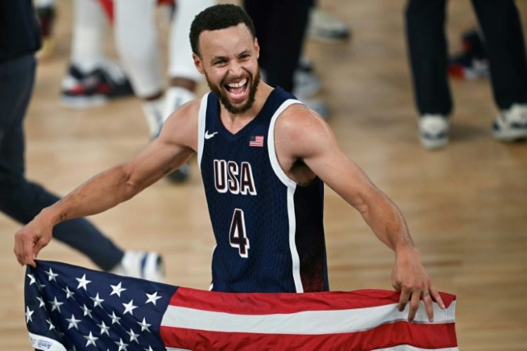 Stephen Curry celebrates after the USA beat France to win basketball gold. ©AFP