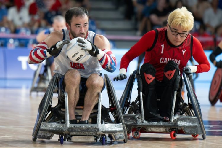 USA's Chuck Aoki (L) in action during the victory over Canada. ©AFP