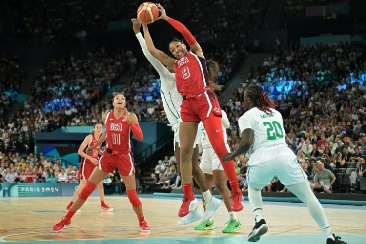 A'ja Wilson of the United States leaps for the ball in the USA's victory over Nigeria in the Olympic women's basketball quarter-finals. ©AFP