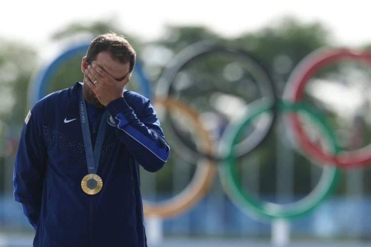 Scottie Scheffler was visibly emotional after receiving his gold medal. ©AFP