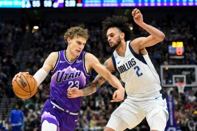 Utah's Lauri Markkanen, at left driving into Dereck Lively of Dallas, has signed an NBA contract extension with the Jazz. ©AFP