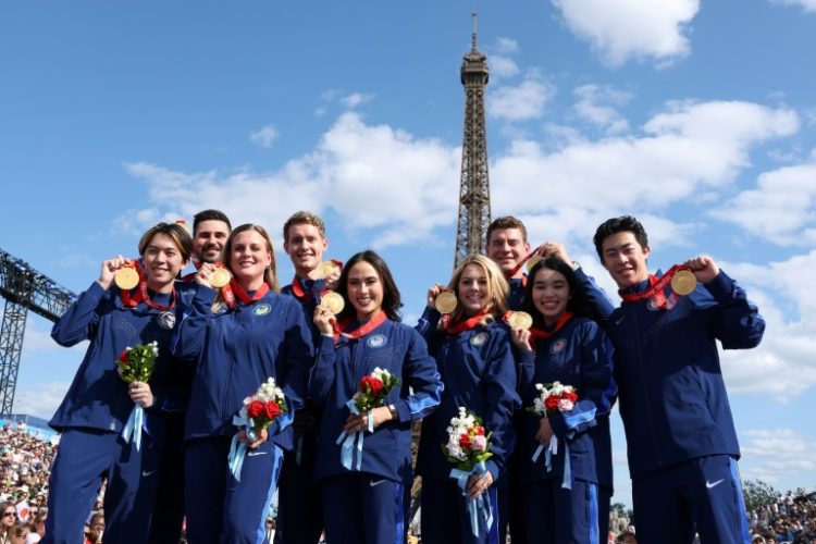 Members of the US figure skating team pose with their medals, following the reallocation of medals from the 2022 Beijing Winter Olympics . ©AFP