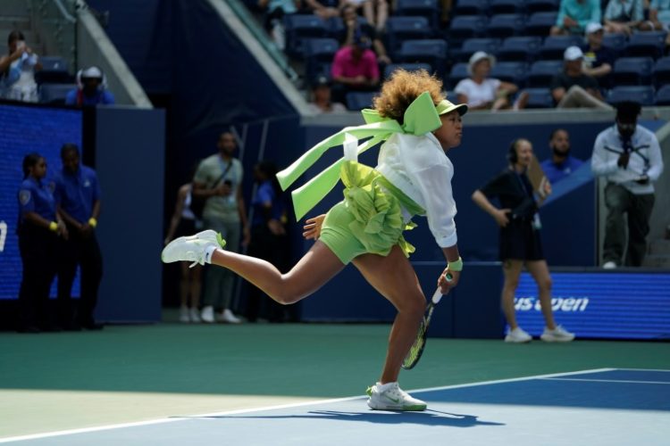 Green day: Naomi Osaka warms up before her match against Jelena Ostapenko at the US Open on Tuesday . ©AFP