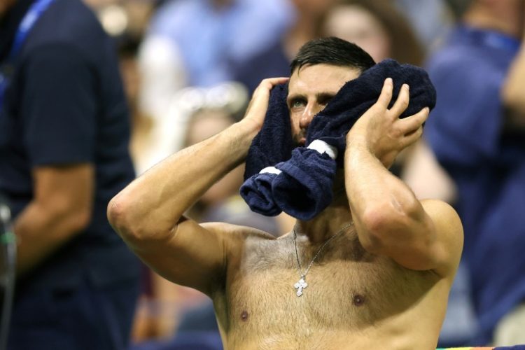 Defending champion Novak Djokovic cools off during his US Open second round victory over Laslo Djere. ©AFP