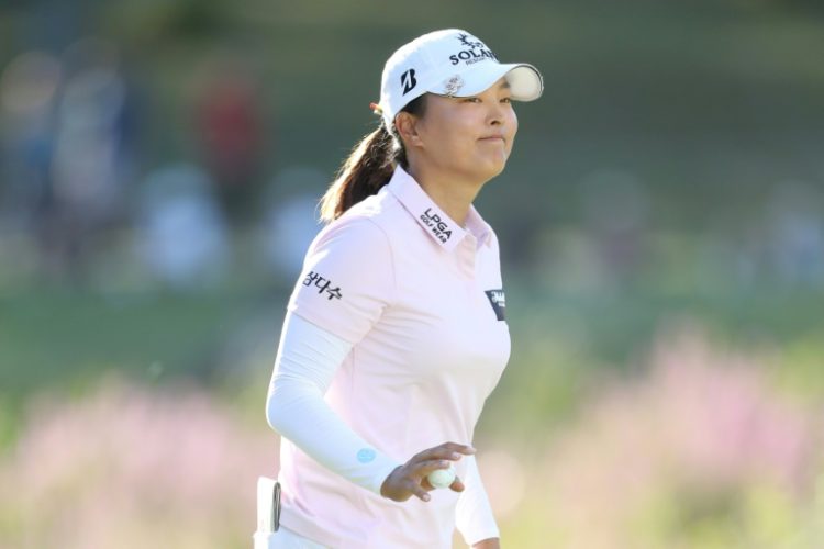 Leader Ko Jin-young of South Korea acknowledges the crowd on the 18th green during the third round of the FM Championship at TPC Boston. ©AFP