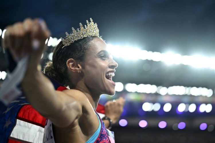 Gold medallist Sydney Mclaughlin-Levrone wears a crown as she celebrates winning the women's 400m hurdles final . ©AFP