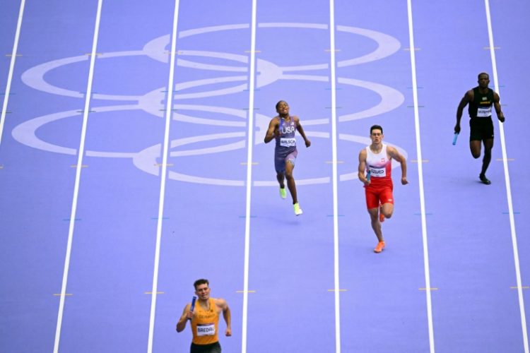 Sixteen-year-old Quincy Wilson (2nd from L) helped the United States into the Olympic 4x400m final. ©AFP