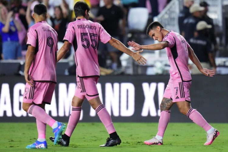 Matías Rojas of Inter Miami, at right celebrating a goal with teammates, scored twice in Miami's 4-3 Leagues Cup knockout round opening victory over Toronto. ©AFP