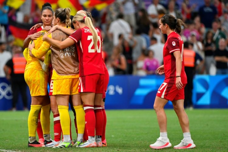 Canada players react after their penalty shoot-out defeat at the hands of Germany in Marseille. ©AFP