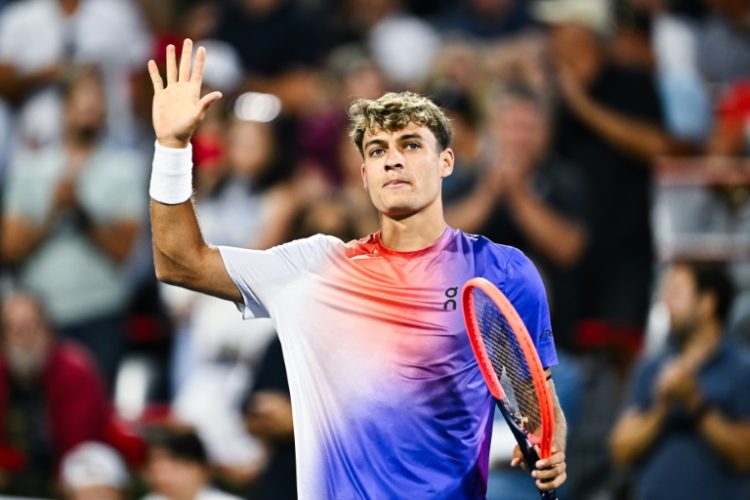 Italy's Flavio Cobolli celebrates a 6-3, 6-2 victory over Felix Auger-Aliassime of Canada at the ATP Montreal Masters. ©AFP