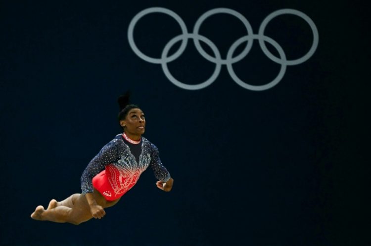 Simone Biles penned another golden chapter to her remarkable career at the Paris Olympics . ©AFP