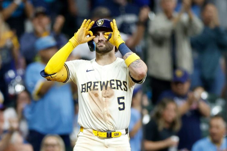 Garrett Mitchell of the Milwaukee Brewers reacts after hitting a run scoring triple in a game against the Philadelphia Phillies. ©AFP