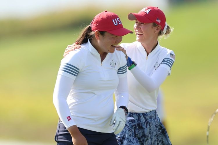 Top-ranked Nelly Korda, right and Allisen Corpuz celebrate a Korda eagle putt as the US duo rallied to win a foursomes match at the Solheim Cup. ©AFP