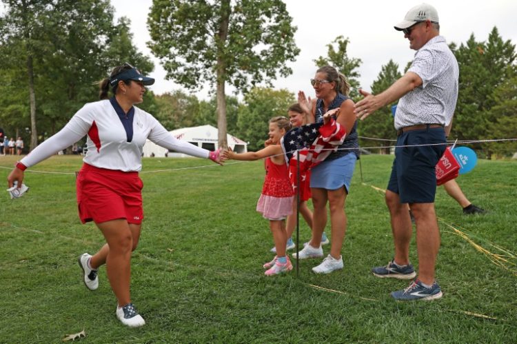 World number two Lilia Vu of the United States reacts with fans during her singles tie that clinched the Solheim Cup for the United States. ©AFP