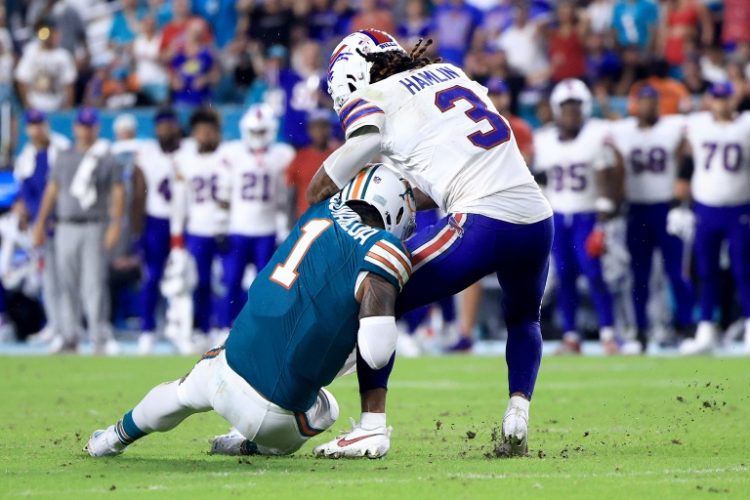 Tua Tagovailoa of the Miami Dolphins collides with Damar Hamlin of the Buffalo Bills during the third quarter in the game at Hard Rock Stadium. ©AFP