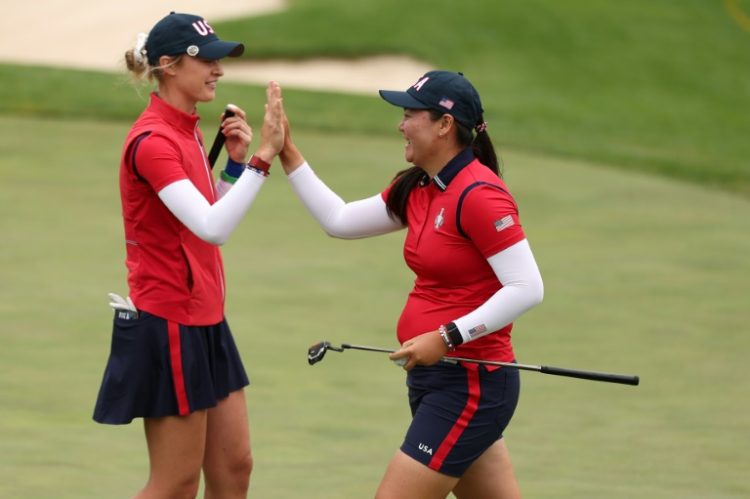 Americans Allisen Corpuz, right, and Nelly Korda celebrate during their foursomes match victory in the opening session of the 19th Solheim Cup. ©AFP