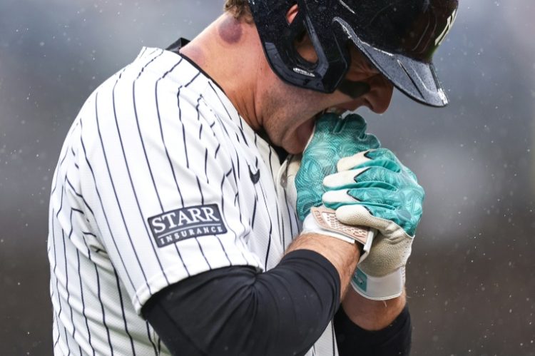 Anthony Rizzo of the New York Yankees bites his hand after being hit by a pitch during a loss to the Pittsburgh Pirates. ©AFP