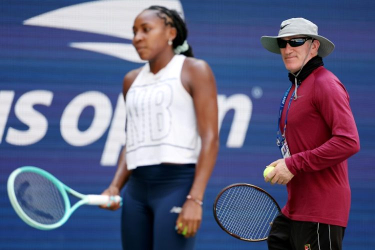 Coach Brad Gilbert, at right watching Coco Gauff during a practice session at the US Open, has split with Gauff, according to statements on social media by both. ©AFP