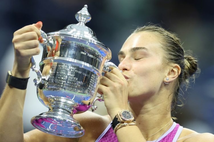 Champion: Aryna Sabalenka kisses the trophy after defeating Jessica Pegula in the US Open final. ©AFP