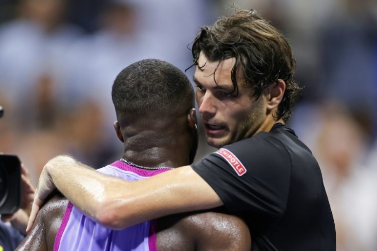 'Body shut down': Taylor Fritz embraces Frances Tiafoe . ©AFP