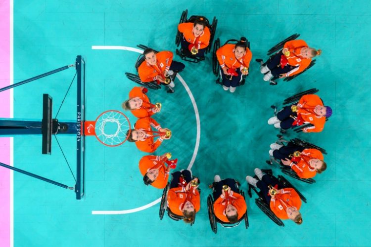 The Netherlands' women's wheelchair basketball team poses after beating the USA in the final to retain their title. ©AFP