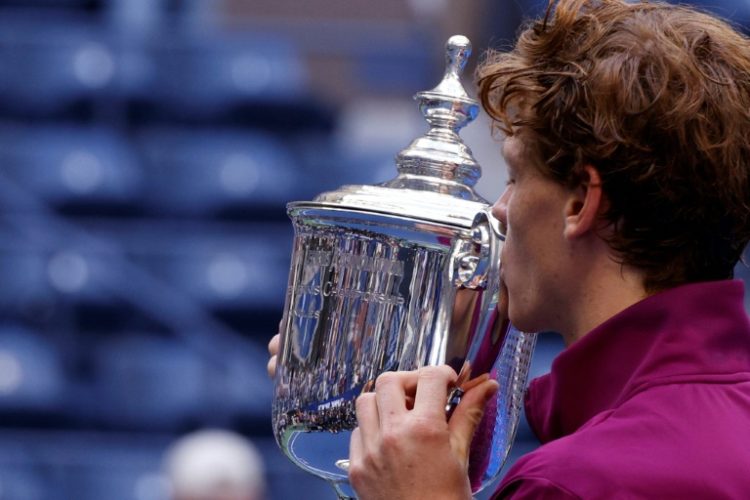 Champion: Jannik Sinner kisses the US Open trophy . ©AFP