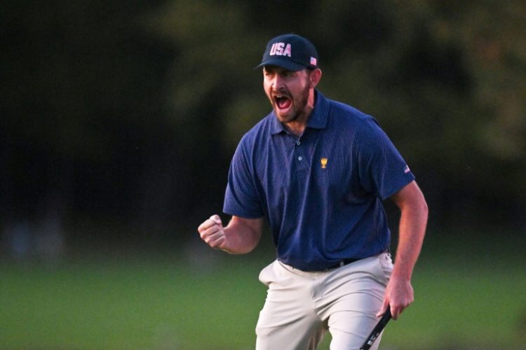 Patrick Cantlay celebrates a match-winning birdie putt that put the United States ahead 11-7 over the Internationals after day three of the Presidents Cup. ©AFP