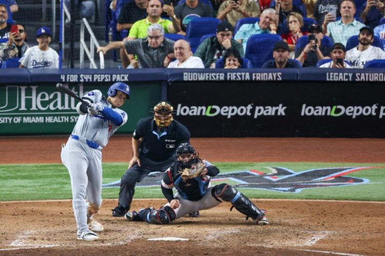 Los Angeles Dodgers star Shohei Ohtani hits a home run in the seventh inning against the Miami Marlins. ©AFP