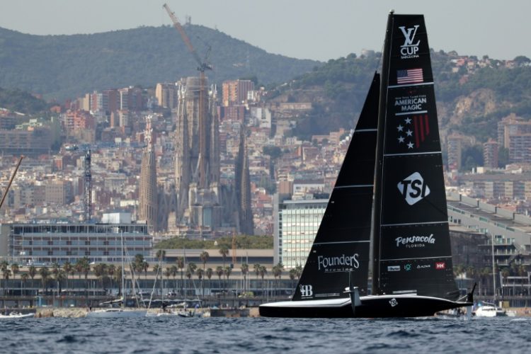 American Magic sails in front of the Sagrada Familia basilica during the Luis Vuitton Cup semis. ©AFP