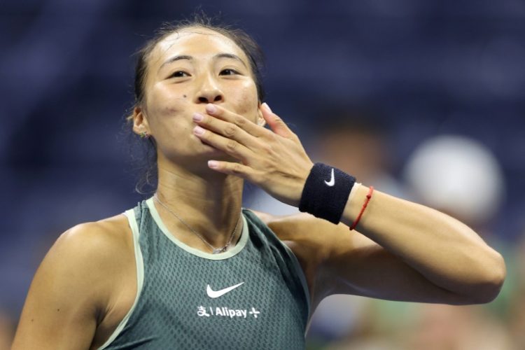 Record: Zheng Qinwen celebrates. ©AFP